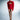 Woman wearing a red dress with a ruffled red jacket on a gray background